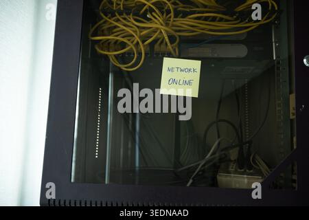 Network Online Confirmation Note on Professional Server Rack Stock Photo