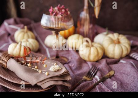 Elegant fall tablescape with pumpkins and seasonal decor Stock Photo