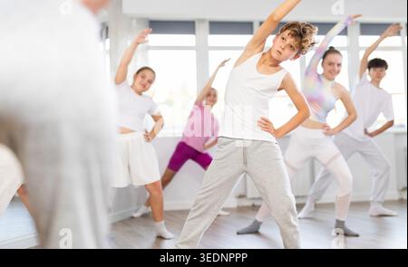 Group of children warming up before dance class Stock Photo