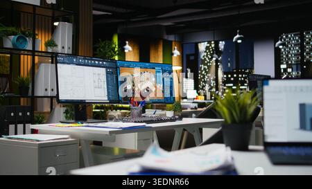 Innovative office featuring dual monitors running advanced 3D rendering programs for interior design and construction planning. Digital workspace built for creativity and project management. Stock Photo