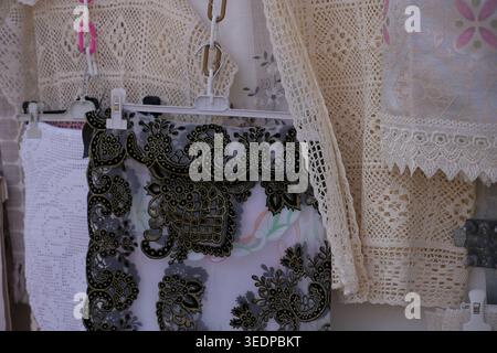 Abstract black gold lace texture backdrop featuring soft off-white crochet weave overlay intricate floral patterns delicate textile surface for copysp Stock Photo