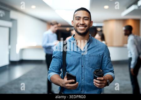Portrait, smile and business man in hotel lobby, about us and event planner with phone. Venue organizer, employee and happy professional with coffee Stock Photo