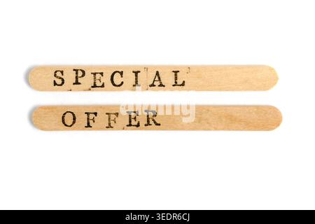 Close up SPECIAL OFFER stamped on two wooden sticks against white background. High detail Stock Photo