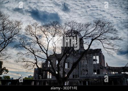 HIROSHIMA, JAPAN - DECEMBER 30, 2025: Dramatic backlighting showcases the skeletal remains of the Atomic Bomb Dome (aka Peace Dome) in Hiroshima, Japa Stock Photo