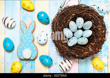 Easter bunny figurine with Easter eggs and Easter nest Stock Photo