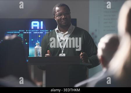 Black Middle Aged Man Presenting Ai Strategy at Business Seminar Stock Photo