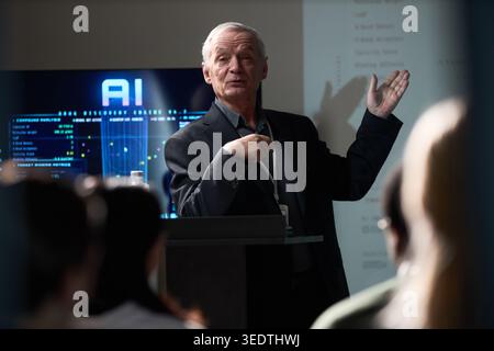 Senior Businessman Explaining Ai Insights during Leadership Workshop Stock Photo
