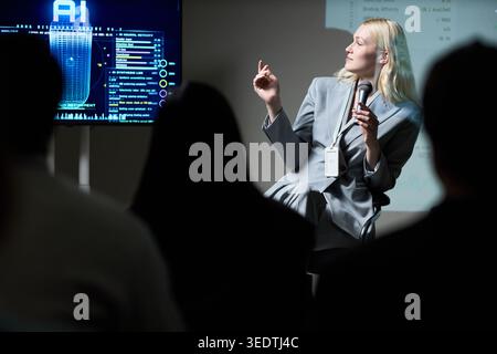 Adult Woman Explaining Ai Research during Technology Panel Stock Photo