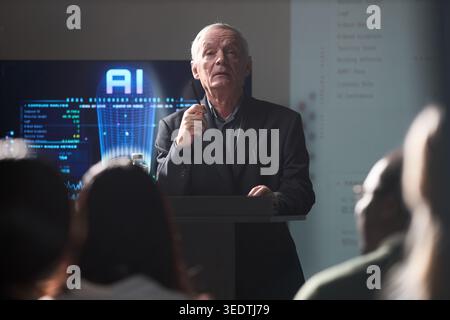Senior Man Presenting Ai Strategy during Business Seminar Stock Photo