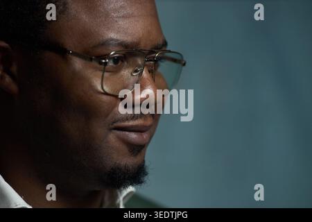 Black Adult Man Wearing Glasses and Smiling for Business Profile Stock Photo