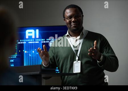 Portrait of Black Man Presenting Ai Strategy in Business Meeting Stock Photo