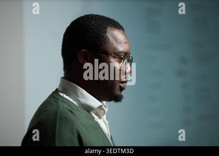 Black Adult Man Wearing Glasses Posing for Corporate Profile Stock Photo