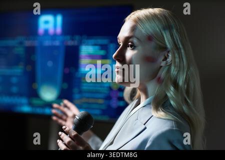 Adult Woman Presenting Ai Technology Strategy in Business Meeting Stock Photo
