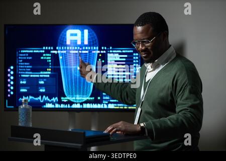 Black Man Presenting Ai Analytics Dashboard for Business Strategy Stock Photo