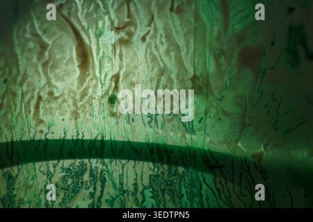 Mysterious abstract texture featuring green grunge background with rusty surface and aged patina resembling copper conveying gloomy intriguing atmosph Stock Photo