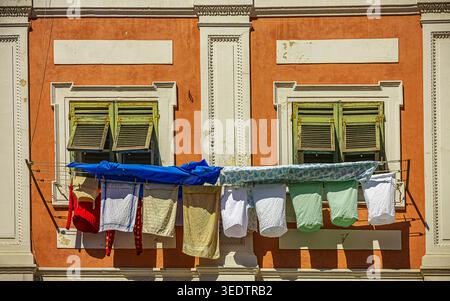 the clothes left to dry in the sun seem to give the environment a moment of joy Stock Photo