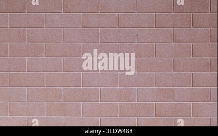 Pink sandblasted brick wall. Full frame, background and texture. Stock Photo