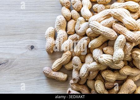 Close-up with a pile of peanuts in their shells Stock Photo