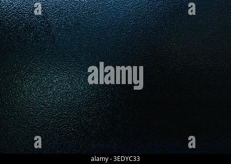 Deep teal blue frosted glass texture with subtle gradient and rough details Stock Photo