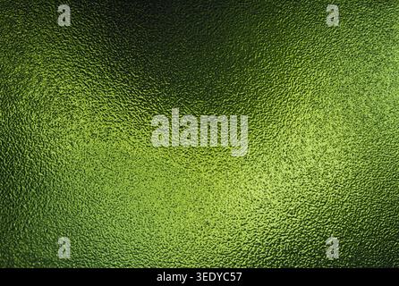Green frosted glass textured surface with bright gradient illumination Stock Photo
