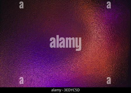 Purple and orange gradient light on rough frosted glass texture Stock Photo