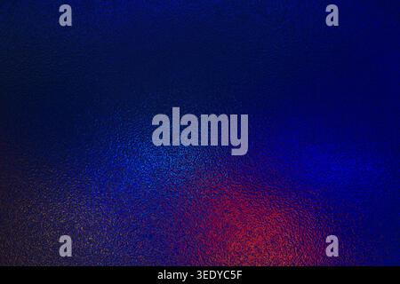 Blue and red neon gradient light on frosted glass texture Stock Photo