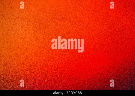 Intense warm red and orange glowing textured background ideal for commercial banners Stock Photo