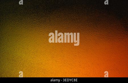 Warm orange to black gradient behind a frosted textured glass surface Stock Photo