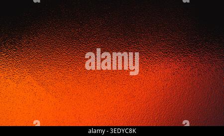 Intense fiery red and orange gradient showing through a bumpy glass texture Stock Photo