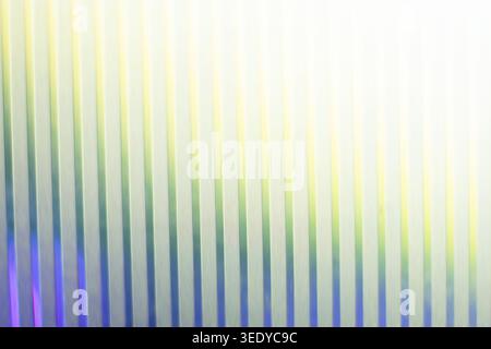Bright vertical ribbed glass texture with glowing light leak effect Stock Photo