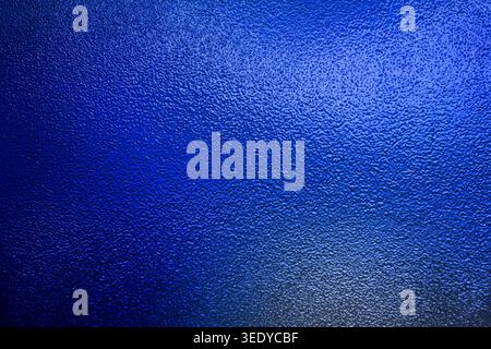 Vibrant royal blue bumpy textured surface with subtle gradient lighting Stock Photo