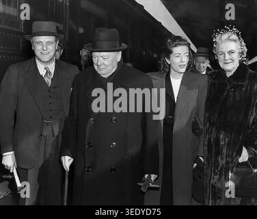 Former British Prime Minister Winston Churchill (second from left) with his wife Clementine Churchill (right), shortly after his arrival in the United States, Abbie Rowe, National Parks Service, Harry S. Truman Library, February 10, 1946 Stock Photo