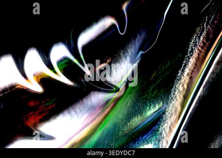 Bright white and green light waves curve across a black abstract frame, creating glossy reflections, neon streaks and distorted iridescent textures wi Stock Photo