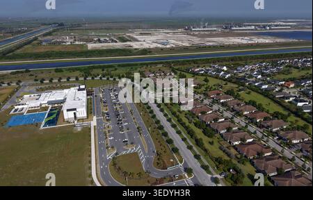 A proposed 200-acre data center and warehouse site known as Project Tango sits on undeveloped land west of Loxahatchee Groves in northern Palm Beach County, Florida on April 30, 2026. The development site is located west of the Arden neighborhood and near Saddle View Elementary School, which are visible in the foreground with residential areas and parking facilities. (Photo by Joe Cavaretta/South Florida Sun-Sentinel/TNS/Sipa USA) Stock Photo