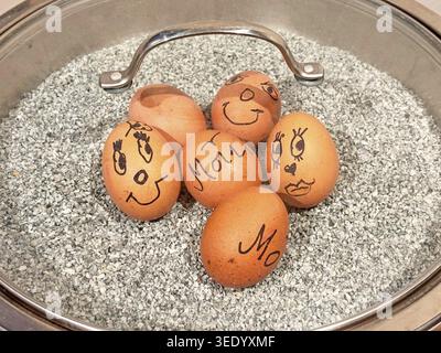 Breakfast eggs in a bowl with heat gravel Stock Photo