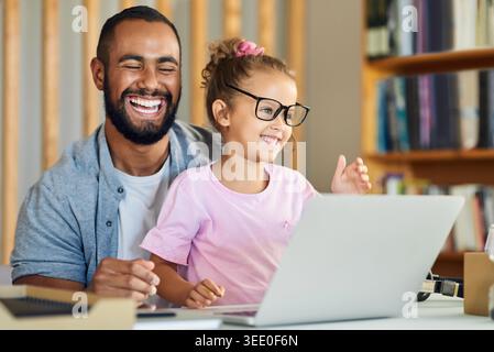 Laughing, father and girl with glasses in home for break, playing together and connection for family. Laptop, funny joke and man with child for Stock Photo