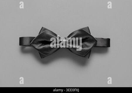 Stylish black bow tie on grey background Stock Photo