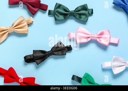 Different stylish bow ties on blue background Stock Photo