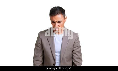 Concerned man looking down feeling disappointment and regret Stock Photo