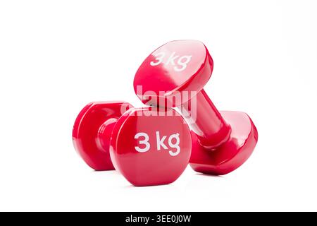 Pair of red dumbbells isolated on white background fitness balance concept Stock Photo