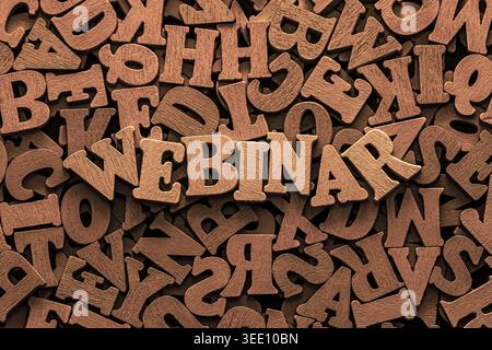 Inscription webinar on pile of old vintage wooden letters. Online education and training concept. Stock Photo