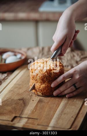 Cutting Easter Bread On Wooden Board Stock Photo