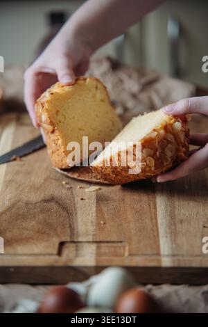 Fresh Easter Bread Slice In Hands Stock Photo
