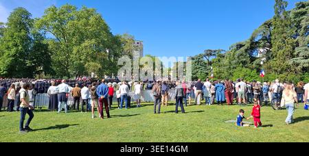 Large crowd and families gathered for the May 8th Victory Day ceremony in Parc de la Tete d'Or, Lyon, France. Stock Photo