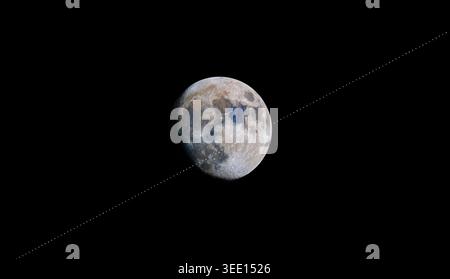 International Space Station Passing in Front of the Moon ISS Stock Photo