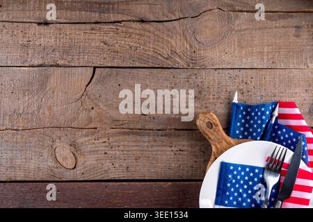 USA patriotic table setting with american flag, plate and decoration in national flag colors on white background. Independence Day. Happy Memorial Day Stock Photo