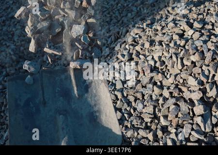 Granite gravel chips materials for the construction. Natural crushed granite gravel as a background. Industrial design. Granite gravel texture Stock Photo