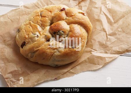 German raisin bread roll or currant bun Stock Photo