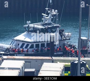 A group of people thought to be migrants are brought in to the Border ...