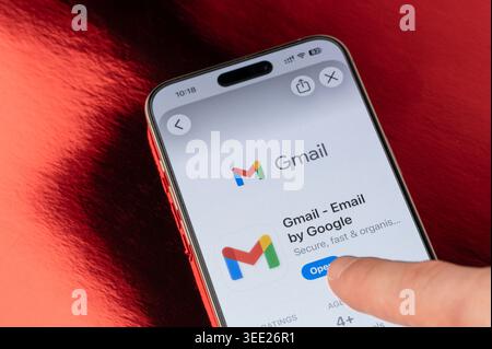 New York, USA - May 5, 2026: Open Gmail app on iphone smartphone screen close up view on red foil background Stock Photo